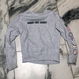 grey ‘sorry not sorry’ top